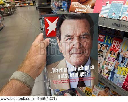 Frankfurt, Germany - Aug 6, 2022: Pov Male Hand Holding Latest Stern Magazine With Gerhard Schroeder