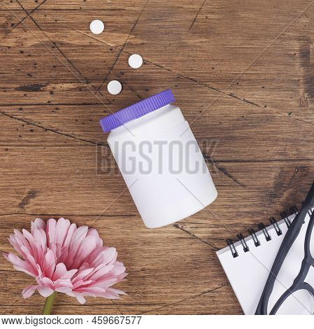 Women Health, Middle Age And Menopause Concept. Health Care Style. Copy Space.plastic Bottle With Pi