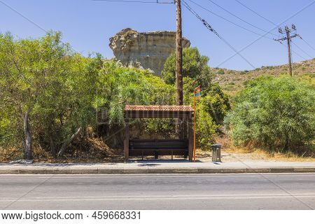 Beautiful View Of Standard Bus Stop On Island Of Rhodes In Greece Against Backdrop Of Beautiful Moun