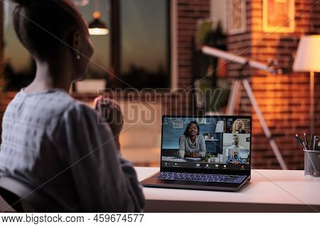 Female Team Lead Chatting With Coworkers On Online Meeting Using Videocall Software And Laptop. Busi