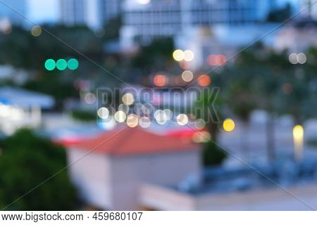 Night City Lights Bokeh Blurred Abstract Background Texture Photo. Defocused Glowing Cityscape In Th