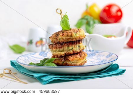 Zucchini Fritters. Traditional Zucchini Fritters In Stack On White Background. Zucchini Pancakes Or 