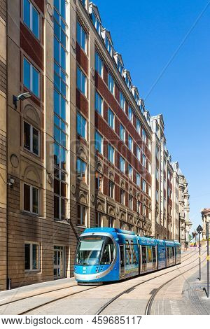Birmingham, Uk - August 11, 2022.  A West Midlands Metro Tram Travelling Along Tracks On The City St