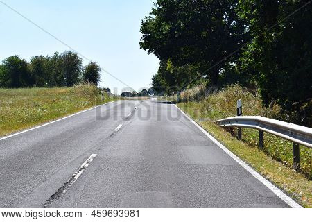 Steep Country Road Into An Eifel Village