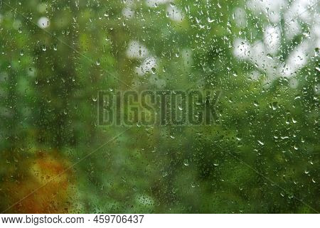 Drops Of Summer Rain On The Window Glass.