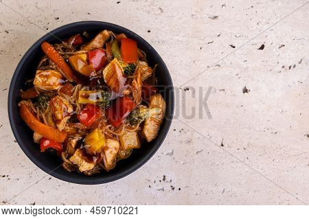 Chicken Yakissoba In Black Ceramic Bowl - Top View.