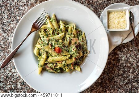Prosciutto Penne With Spinach - Colorful Pasta Plate Served With Parmigiano Reggiano