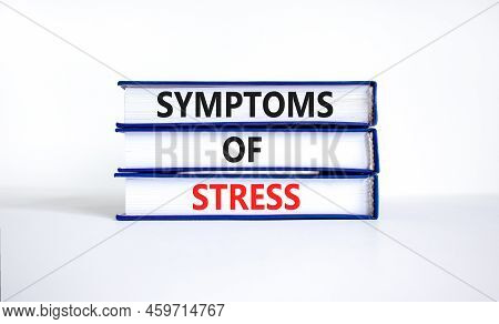 Symptoms Of Stress Symbol. Concept Words Symptoms Of Stress On Books. Beautiful White Table White Ba