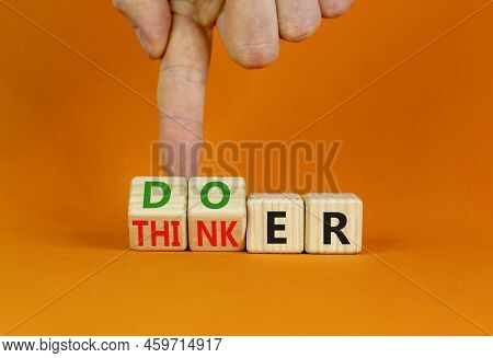 Doer Or Thinker Symbol. Concept Words Doer Or Thinker On Wooden Cubes. Businessman Hand. Beautiful O