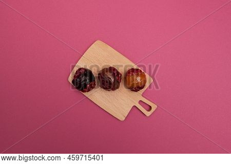 Healthy Oriental Sweets. Halves Of Prunes, Dried Apricots And Nuts Are Joined Together By Condensed 