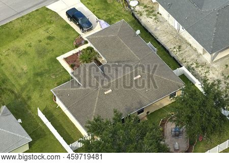 Aerial View Of Typical Contemporary American Private House With Roof Top Covered With Asphalt Shingl