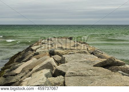 A Rock Jetty Going Out Into The Atlantic Ocean In Oak Bluffs Massachusetts On Martha Vineyard On An 