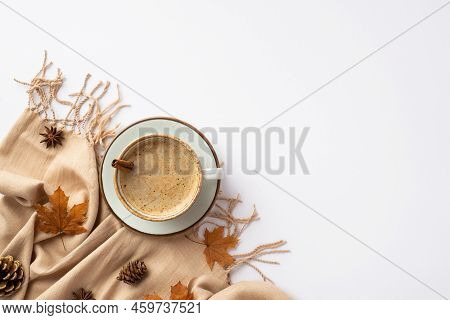 Autumn Concept. Top View Photo Of Cup Of Hot Drinking With Cinnamon Stick On Saucer Fallen Maple Lea