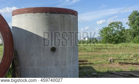 Reinforced Concrete Storm Sewer Pipes Of Large Diameter Stacked At A Construction Site. Sewer Large 