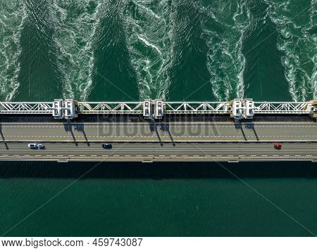 Water Rushing Through A Storm Surge Barrier In The Netherlands