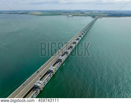 Water Rushing Through A Storm Surge Barrier In The Netherlands