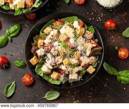 Vegetarian Ceasar Salad With Meat Free Chicken Pieces Cherry Tomatoes Croutons And Lettuce.