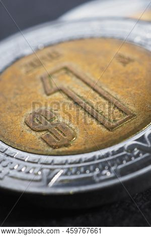 Coin Of 1 One Mexican Peso Close-up. Peso Of Mexico. News About Economy Or Currency. Loan And Credit