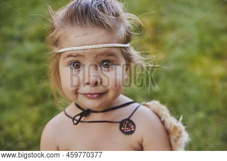 Cute Baby Dressed In The Clothes Of Primitive People