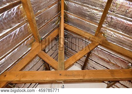 Aluminium Foil Roof Insulation Exposed In A Vaulted Ceiling After Wood Panelling Removed