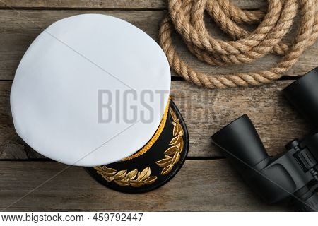 Peaked Cap, Rope And Binoculars On Wooden Background, Flat Lay