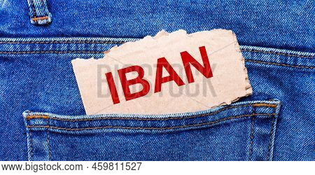 In The Back Pocket Of The Jeans There Is A Brown Piece Of Paper With The Text Iban International Ban