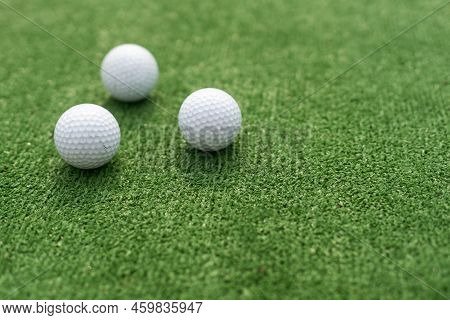 A Golf Club And A Ball During A Mini Golf Game