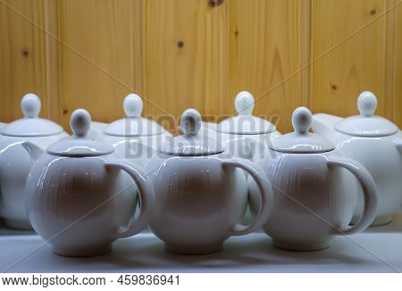 Many Coffee Pots Stand Side By Side In One Compartment.
