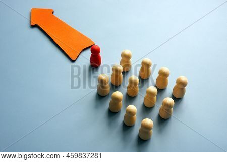 Autocratic Leadership Concept. Arrow And Column Of Figurines With One In Front.