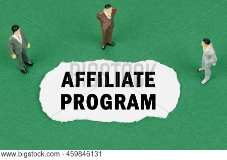 Business And Finance Concept. On The Green Surface There Are Figures Of Businessmen And There Is Tor
