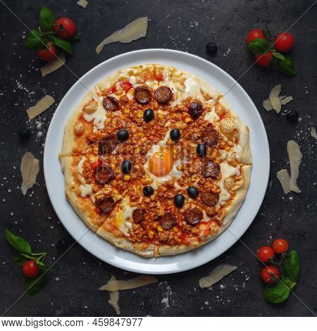 Traditional Italian Pizza With Sasuages, Egg And Chillies Beans