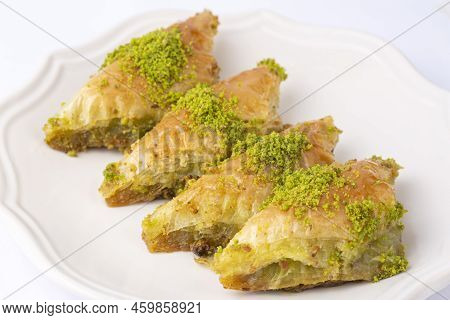 Turkish Dessert Sobiyet Baklava. Turkish Pistachio Baklava On A White Background. Local Name şöbiyet