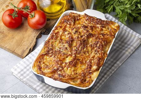 Pasta Casserole Bechamel Sauce Topped With Melted Mozzarella Cheese And Served In A White Baking Dis