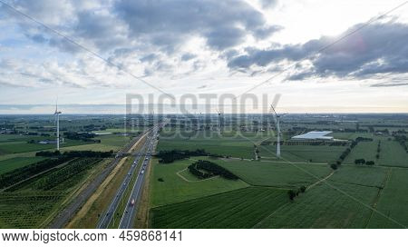 Brecht, Belgium, 6th Of July, 2022, Panoramic Aerial Drone View Of Wind Farm Or Wind Park, With High