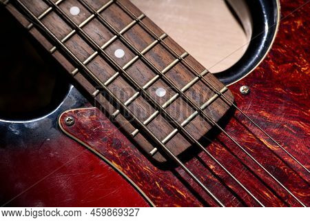 Metallic Volume Treble Guitar Bass Knobs. Electric Guitar. Red Electric Bass Guitar Close-up. Musica
