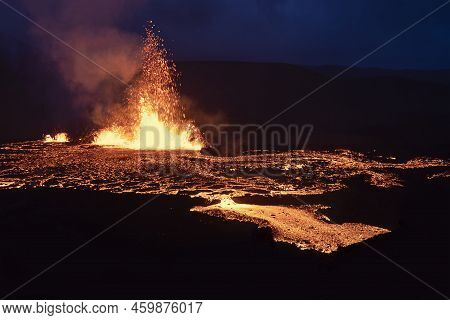 Volcano Eruption At Meradalir Near Fagradalsfjall, Iceland. Erupting Magma And Flowing Lava At Night