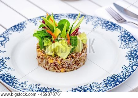 Quinoa Salad With Avocado, Carrot, Chickpeas And Fresh Greens