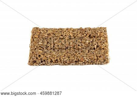 Sunflower Kozinak Tile From Sunflower Seeds And Molasses On A White Background. Oriental Sweet Like 