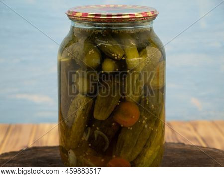 Preservations, Conservation. Salted, Pickled Cucumbers In A Jar On An Wooden Table. Pickling Cucumbe