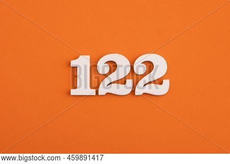 White Wooden Number 122 On Eva Rubber Orange Background