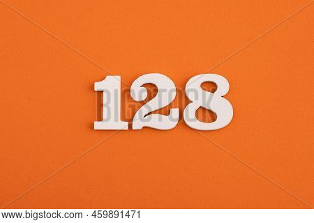 White Wooden Number 128 On Eva Rubber Orange Background