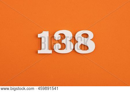 White Wooden Number 138 On Eva Rubber Orange Background