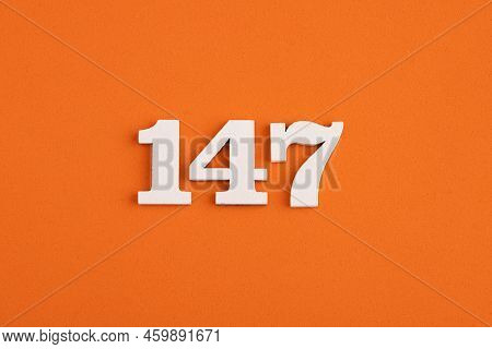 Number 147 - On Orange Foam Rubber Background