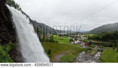 Water From The Fosselva River Drops Down The 50 M High Powerful Steindalsfossen, Norway