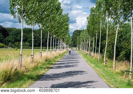 Zwolle, Overijssel, The Netherlands, 07 15 2022 - Bicycle Path At The Dike Of The River Ijssel Flood