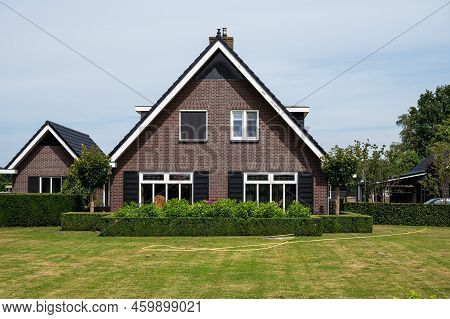 Harskamp, Gelderland, The Netherlands - 07 14 2022 - Country House With Front Yard, Surrounded By Tr