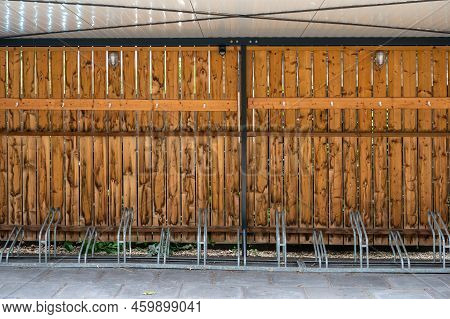 Harskamp, Gelderland, The Netherlands - 07 14 2022 - Wooden Bicycle Stand At The Reformed Church