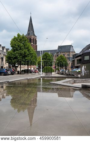 Brecht, Antwerp Province, Belgium - 07 08 2022 - Historical City Center Reflecting In A Fountain