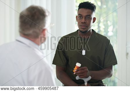 Military Man With Tired Red Eyes Talking To General Pracitioner About New Medicine He Recommended