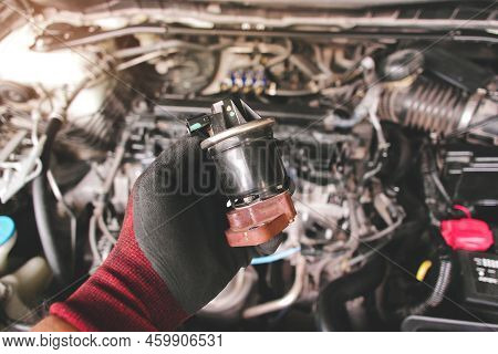Close Up Of The Egr Exhaust Gas Recirculation In The Auto Mechanic Hand, Automotive Part Concept.